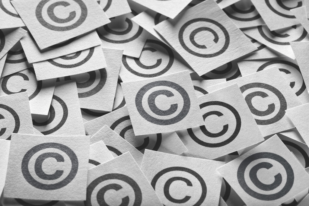 Various copyright sign on a square paper